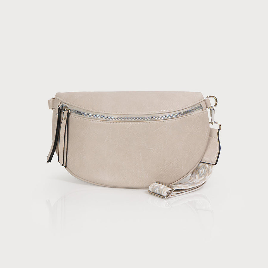 Semi-circle shape belt bag with zipper closure and inside pocket. Adjustable printed guitar strap. Imitation leather 7129-E-CRM